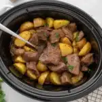 Crockpot loaded steak and potato bake with tender steak and melted cheese